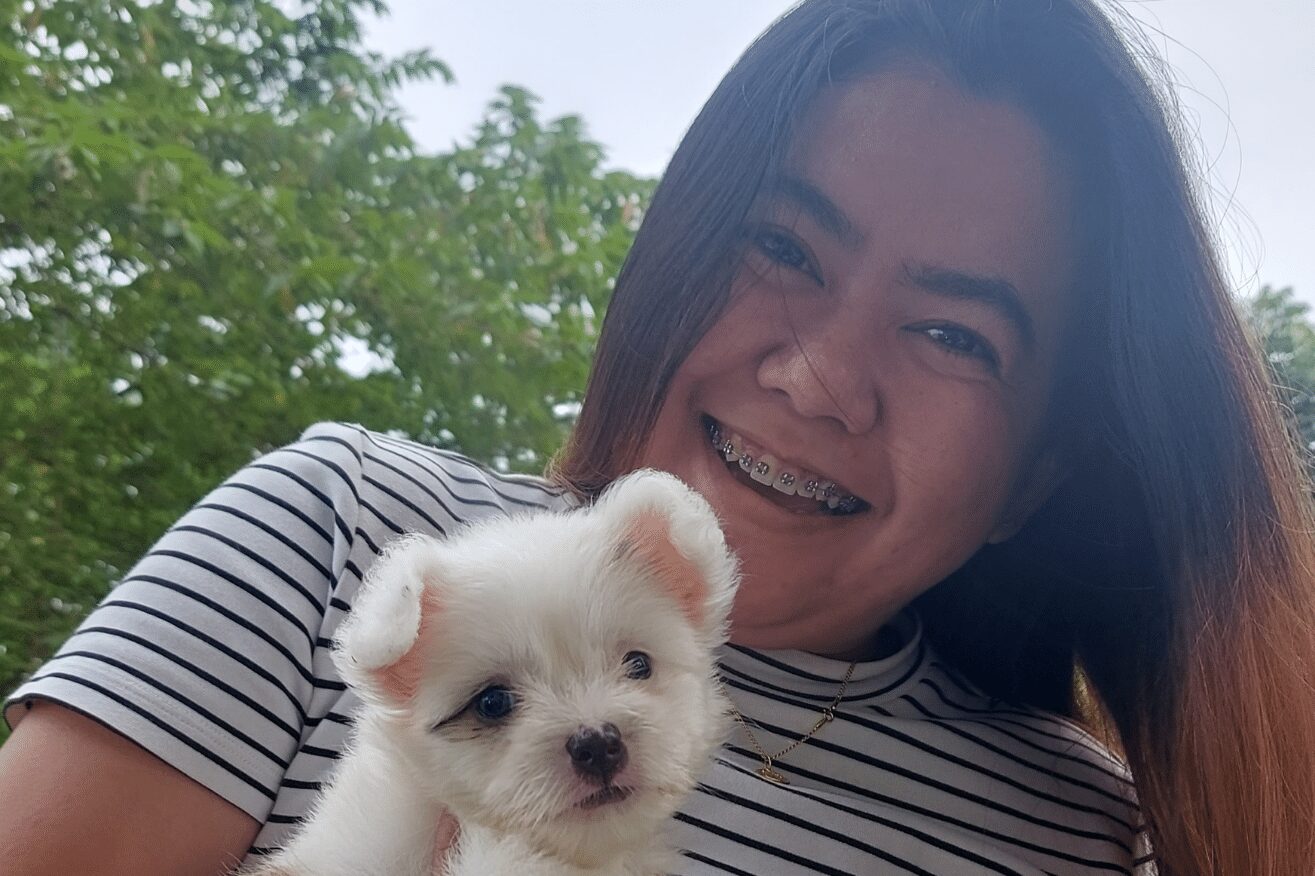 Picture of Rica holding a dog